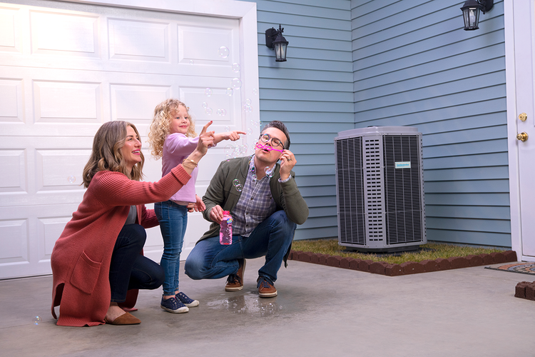 family-blowing-bubbles-comfortmaker
